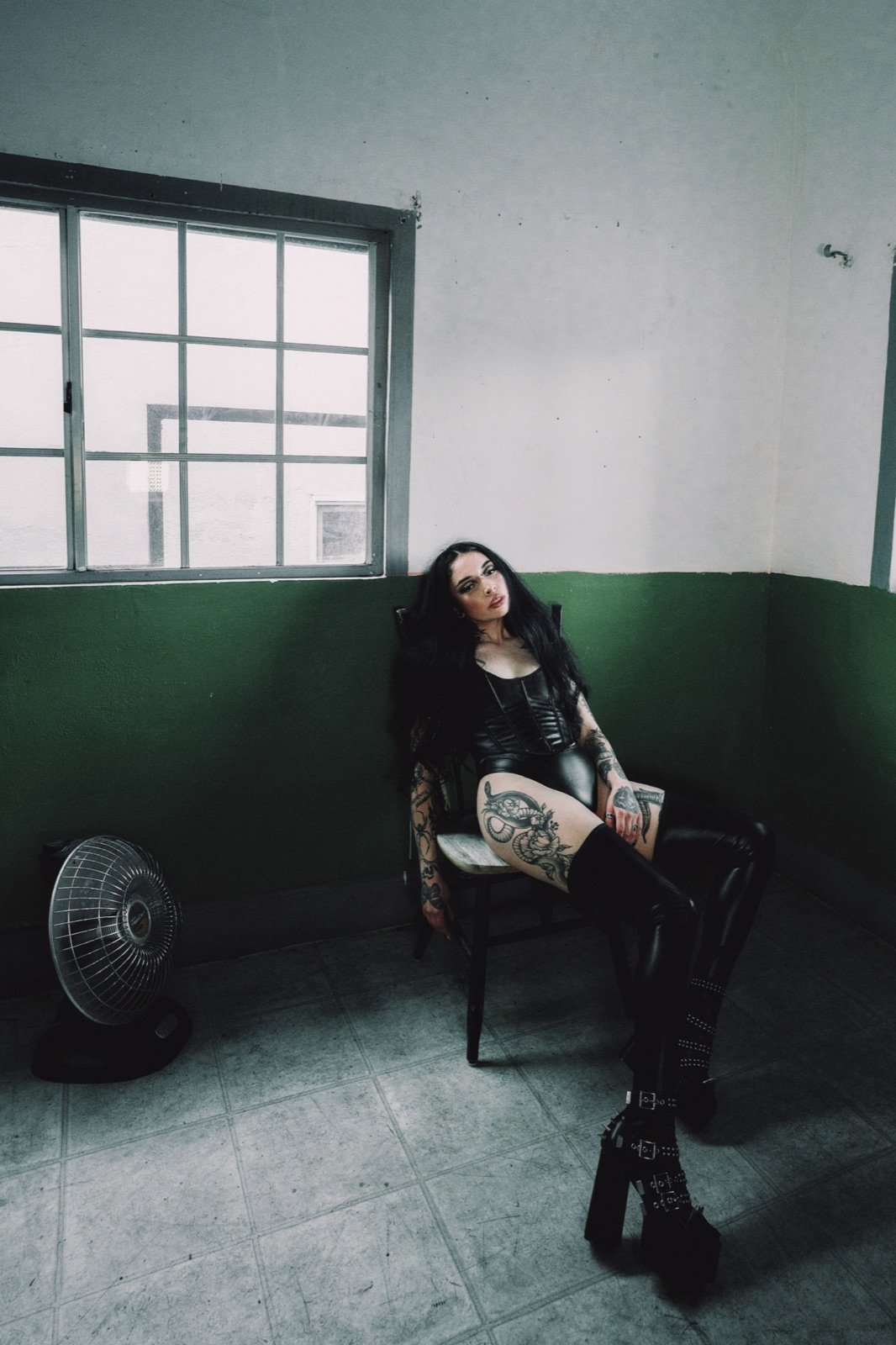 Black lace, seated by the window