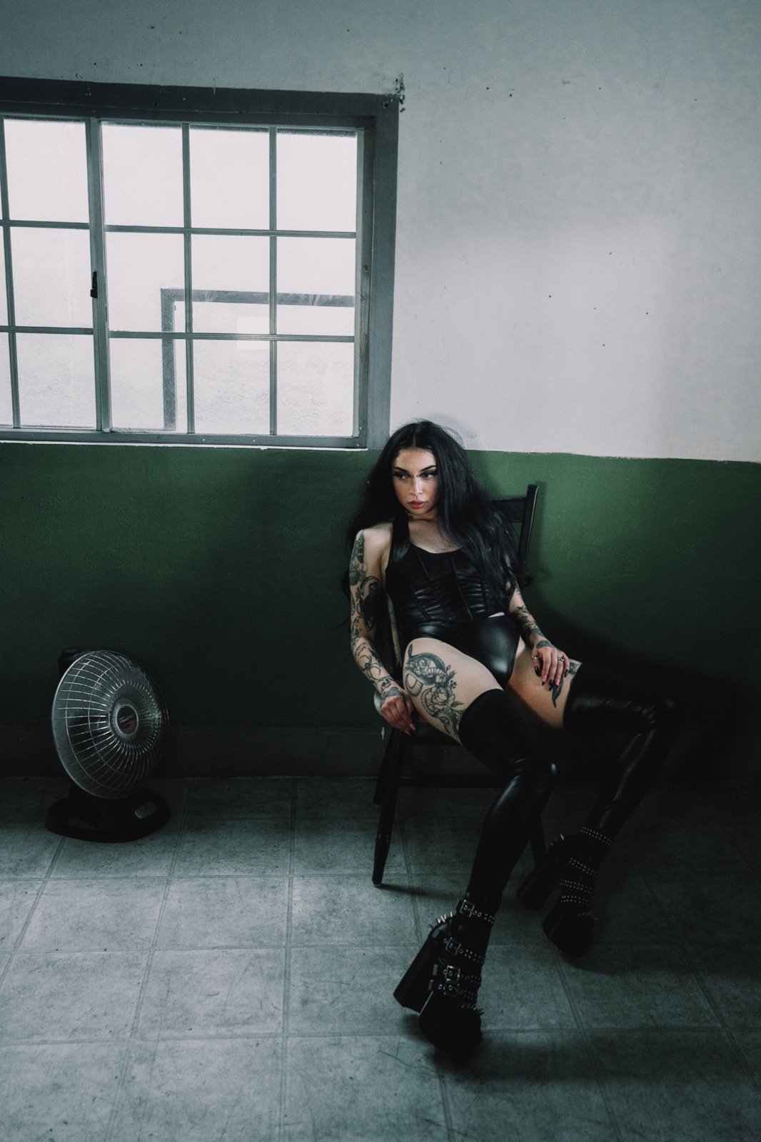 Platform boots in a green-walled room