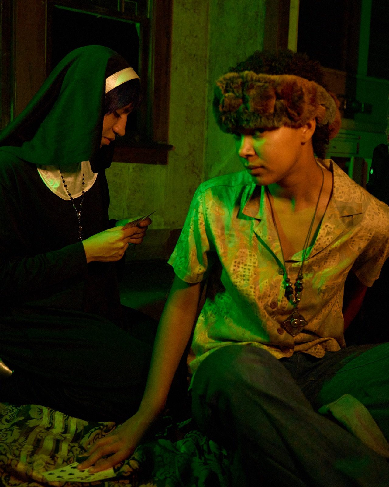 Fortune cards and a nun, green light