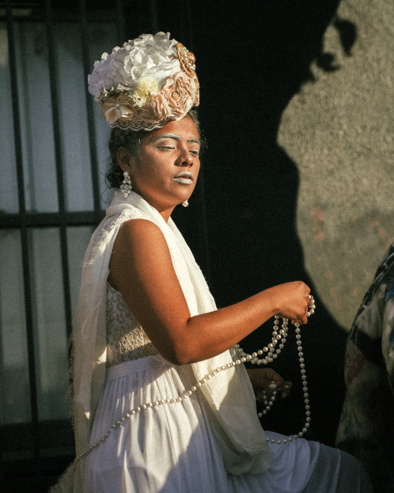 Flower headpiece and pearls in hard light