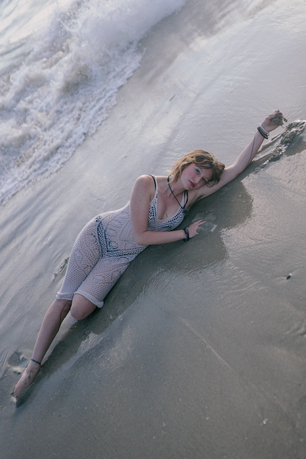 Crochet dress, lying at the waterline