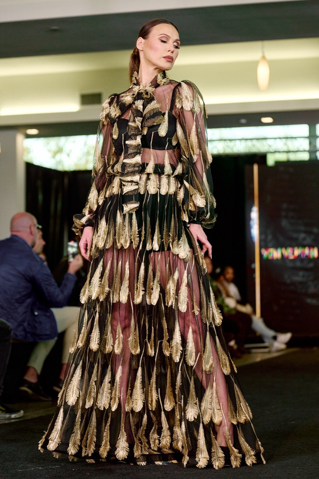 Sheer gown with gold feather prints
