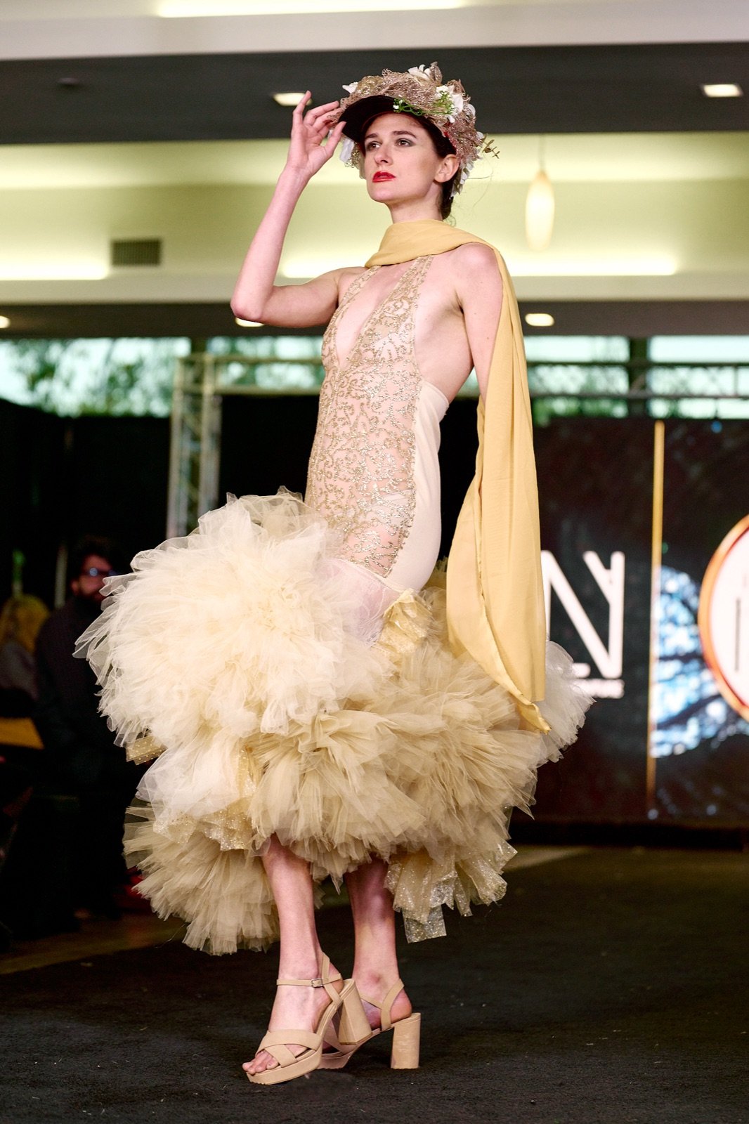 Gold lace and tulle with a yellow sash